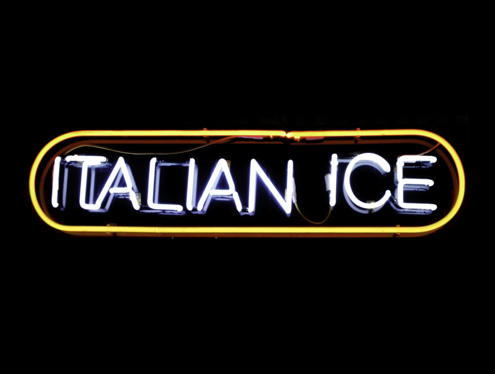 Neon sign in window of restaurant, isolated on black